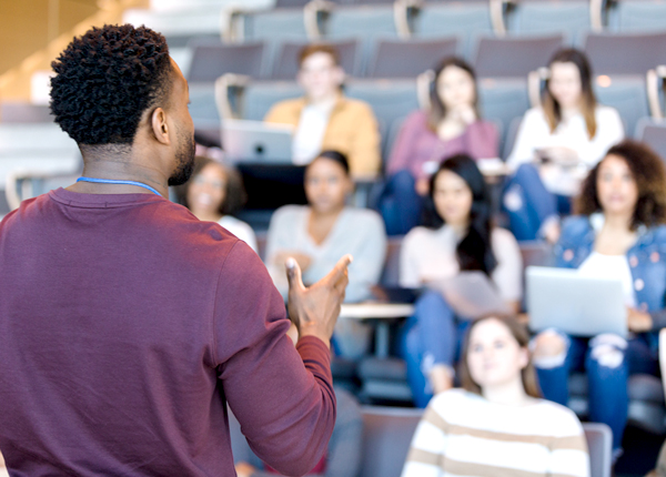 An instructor is giving a lesson, representing the concept of community college insurance. 